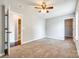 Bedroom featuring carpet flooring and multiple doors to bathroom and closet at 1706 Baylor Dr, Rock Hill, SC 29732