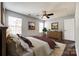 Cozy bedroom featuring natural light, a ceiling fan, wood floors, and neutral paint at 1706 Baylor Dr, Rock Hill, SC 29732