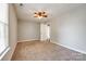 A cozy bedroom featuring neutral paint, carpet floors, and a ceiling fan with great natural light at 1706 Baylor Dr, Rock Hill, SC 29732