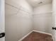 Walk-in closet space features metal shelving and carpeted floor, providing practical storage solutions at 1706 Baylor Dr, Rock Hill, SC 29732