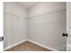 Walk-in closet space features metal shelving and carpeted floor, providing practical storage solutions at 1706 Baylor Dr, Rock Hill, SC 29732
