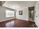Elegant dining room featuring wood floors, large window, and view to kitchen at 1706 Baylor Dr, Rock Hill, SC 29732
