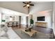 Bright living room boasts vaulted ceilings, wood floors, and is open to the dining area with modern light fixtures at 1706 Baylor Dr, Rock Hill, SC 29732
