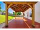 Backyard view of a wooden pergola on a painted patio space adjacent to the house and yard at 1706 Baylor Dr, Rock Hill, SC 29732