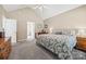 Inviting bedroom with vaulted ceiling, neutral tones, and comfortable bed at 1921 Williford Woods Ln, Rock Hill, SC 29730