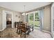 Bright dining area features a wooden table, large window, and charming chandelier at 1921 Williford Woods Ln, Rock Hill, SC 29730