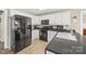Functional kitchen featuring black appliances, solid countertops, and ample cabinet space at 1921 Williford Woods Ln, Rock Hill, SC 29730