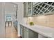 Convenient butler's pantry with ample counter space, glass-front cabinets, and a wine rack at 2005 Waxhaw Crossing Dr # 241, Waxhaw, NC 28173