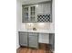 Gray painted butler's pantry features beautiful cabinetry with a wine rack and sleek countertop at 2005 Waxhaw Crossing Dr # 241, Waxhaw, NC 28173