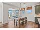 Charming dining area with natural light, stylish light fixture, and views into the living room at 2005 Waxhaw Crossing Dr # 241, Waxhaw, NC 28173