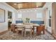 Stunning dining room with wood ceiling, modern light fixture, and seating for six at 2005 Waxhaw Crossing Dr # 241, Waxhaw, NC 28173