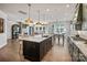Open-concept kitchen featuring a large island with pendant lighting and an adjoining living space at 2005 Waxhaw Crossing Dr # 241, Waxhaw, NC 28173