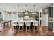Spacious kitchen with seating at the large island, pendant lighting, and hardwood floors at 2005 Waxhaw Crossing Dr # 241, Waxhaw, NC 28173