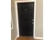 Dark, secure front door with unit number 328 at 201 S Hoskins Rd # 328, Charlotte, NC 28208