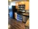 Modern kitchen appliances and wooden cabinets with great counter space at 201 S Hoskins Rd # 328, Charlotte, NC 28208