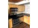Stainless steel appliances and wood cabinets add a modern touch to the kitchen at 201 S Hoskins Rd # 328, Charlotte, NC 28208