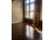 Inviting living room featuring brick accent wall and large windows for natural light at 201 S Hoskins Rd # 328, Charlotte, NC 28208