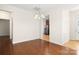 Open dining room with hardwood floors and stainless steel appliances in the kitchen at 20241 Dovekie Ln, Indian Land, SC 29707