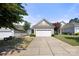 Single-story home featuring low maintenance landscaping and two car garage at 20241 Dovekie Ln, Indian Land, SC 29707