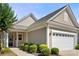 Charming single-story home with a well-manicured lawn and attached two car garage at 20241 Dovekie Ln, Indian Land, SC 29707