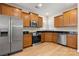 Well-lit kitchen with stainless steel appliances and wooden cabinets at 20241 Dovekie Ln, Indian Land, SC 29707