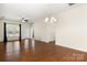 Open living room with hardwood floors, ceiling fan, and lots of natural light at 20241 Dovekie Ln, Indian Land, SC 29707