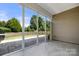 This screened-in porch features tile floors and a beautiful view of the fenced-in yard at 20241 Dovekie Ln, Indian Land, SC 29707