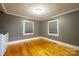Bedroom with hardwood flooring, natural light and washer and dryer included at 2509 1St St, Statesville, NC 28677