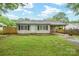 Charming single-story home featuring a covered carport and a well-maintained front lawn at 2509 1St St, Statesville, NC 28677