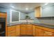Functional kitchen features wood cabinets, granite countertops, and stainless steel sink with a modern faucet at 2509 1St St, Statesville, NC 28677