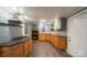 Kitchen with granite countertops, stainless steel appliances, and wood cabinets at 2509 1St St, Statesville, NC 28677