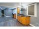 Kitchen with view into the office space, with granite countertops and wood cabinets at 2509 1St St, Statesville, NC 28677