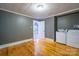 Gray laundry room with a door to another room and natural light at 2509 1St St, Statesville, NC 28677
