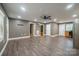 Open-concept living room boasting updated flooring, neutral paint, and ample natural light at 2509 1St St, Statesville, NC 28677