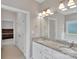 Bathroom featuring double sinks with granite counters and bright lighting at 275 Dorothy Dr, China Grove, NC 28023
