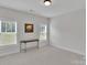 Bedroom featuring light-colored carpet and paint with two bright windows and a decorative table at 275 Dorothy Dr, China Grove, NC 28023