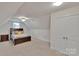 Bright bedroom features vaulted ceilings, a ceiling fan, a bed, and a double door closet at 275 Dorothy Dr, China Grove, NC 28023