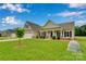 Charming single-Gathering home with manicured lawn, stone accents, and a welcoming front porch at 275 Dorothy Dr, China Grove, NC 28023