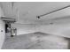Spacious garage featuring a concrete floor and storage shelving for organization at 275 Dorothy Dr, China Grove, NC 28023