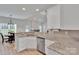 Well-lit kitchen with granite countertops, stainless steel appliances, and an open concept floor plan at 275 Dorothy Dr, China Grove, NC 28023