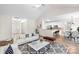 Open concept living area with modern furnishings connecting seamlessly to the kitchen and dining area at 275 Dorothy Dr, China Grove, NC 28023