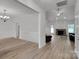 Bright, open-concept living area features a stone fireplace and light wood flooring, creating a cozy atmosphere at 275 Dorothy Dr, China Grove, NC 28023