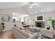 Inviting living room seamlessly connects to the kitchen, featuring a cozy fireplace and modern furnishings at 275 Dorothy Dr, China Grove, NC 28023