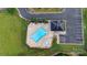 Aerial view of community pool with tanning deck, hot tub, and ample parking at 275 Dorothy Dr, China Grove, NC 28023