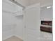 Walk-in closet with wire shelving adjacent to main bedroom at 275 Dorothy Dr, China Grove, NC 28023