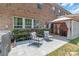 This patio features a stylish gazebo and striped chairs, creating a cozy backyard retreat at 3159 Hartson Pointe Dr, Fort Mill, SC 29707