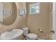 Half bathroom featuring modern fixtures, decorative mirror, and beige walls at 3159 Hartson Pointe Dr, Fort Mill, SC 29707
