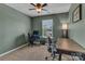 This versatile home office features a modern desk, comfortable chairs, and a window that provides natural light at 3159 Hartson Pointe Dr, Fort Mill, SC 29707