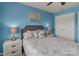 This bedroom includes neutral decor with a gray upholstered headboard, bedside tables with lamps, and white closet doors at 3159 Hartson Pointe Dr, Fort Mill, SC 29707