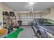 Well-organized two-car garage with storage shelving and epoxy flooring at 3159 Hartson Pointe Dr, Fort Mill, SC 29707